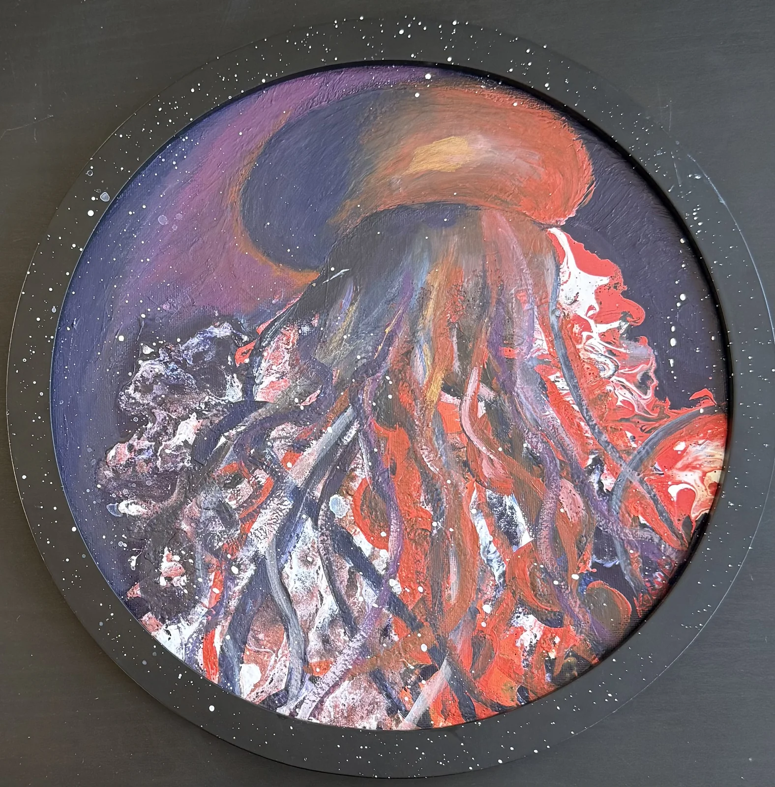 Dark abstract jellyfish form with gold and shadow on round canvas.